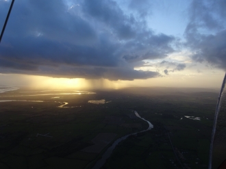 Dodging showers, by Andy Bill. Andy trying to stay dry on a local flight <br>in his Quantum 912 from Over Farm, Gloucester.