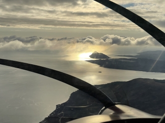 Holy Isle, by Calum Mackay. “I was on a short flight in a Skyranger from Strathaven to the Isle of Arran via Bute, and saw the<br>Holy Isle lit up by the sun, so took a photo then circled around it before returning to base,” said Calum.