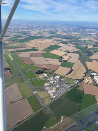 Humberside, by Ramesh Nayak. “Humberside International Airport with a KLM Cityhopper in front of the <br>terminal on a bright crisp winter day, taken from my C42C on a local flight from North Coates,” said Ramesh.
