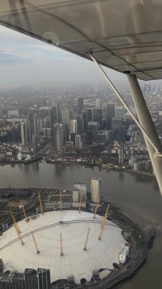 Millennium Dome, by Maximus Marcou. “I completed a zone transit over London City on New Year’s Day morning. <br>The picture shows the Millennium Dome and the skyscrapers in Canary Wharf,” said Maximus, who was in a Skyranger from Hunsdon.