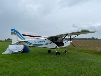 John Sundy, by Eddie McCallum. “John as snug as a bug as the drizzle drops down on Athey’s Moor during Fly-UK,” said airfield owner Eddie.