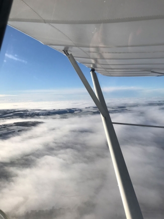 Clouds, by Gary Hanlon. Gary on top of the world in his C42 on an early morning flight from Membury to Eggesford, near Exeter.