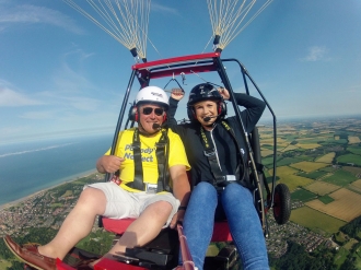 Coastal flight, by Paul Dean. Paul Dean and Laura Elevry enjoying a flight along the coast near Cromer, Norfolk in Paul’s Aerochute from their club airfield at Northrepps.