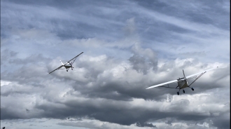 Dogfight by Chris Williams. Skyranger versus C42 on a low pass at Old Park Farm airfield in South Wales.